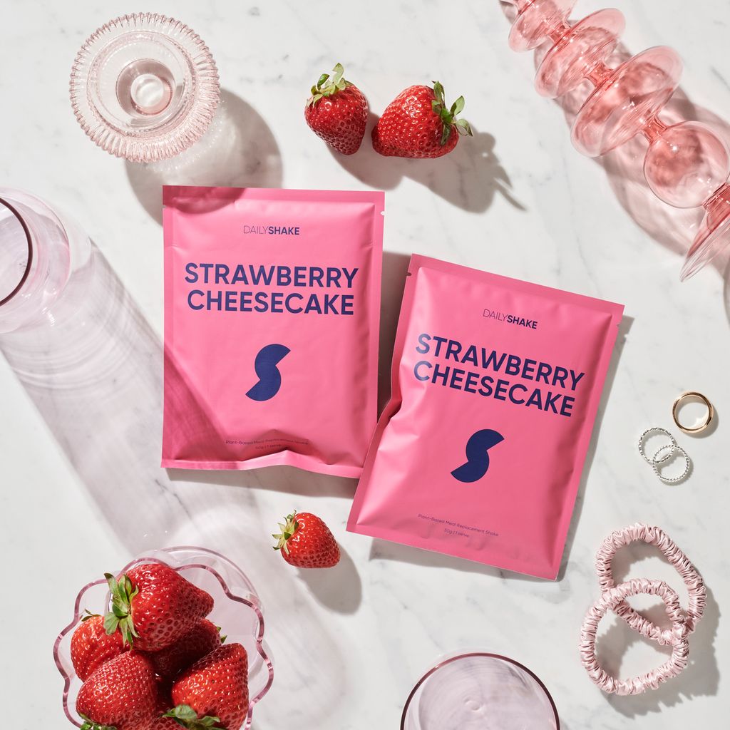 Strawberry Cheesecake Daily Shake sachets and strawberries